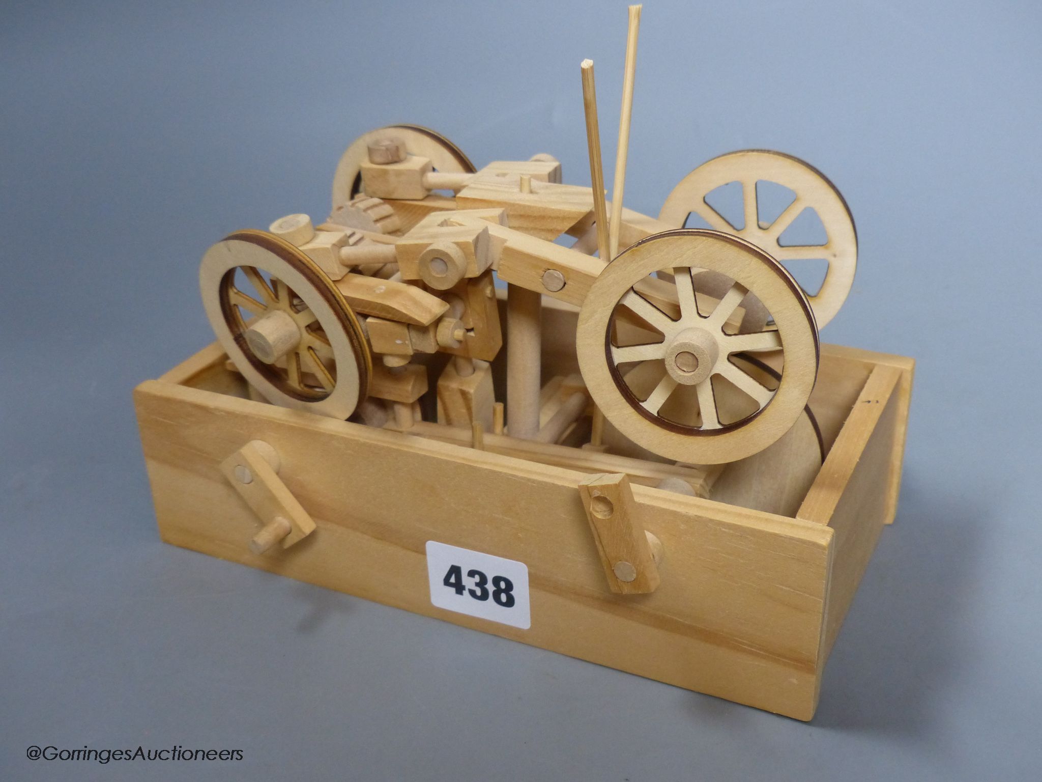 Two modern lightwood mechanical veteran motor cars, and a three masted battleship model